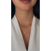 Load image into Gallery viewer, 18-karat yellow gold Double Arabic letter necklace with a yellow gold chain on a girl.