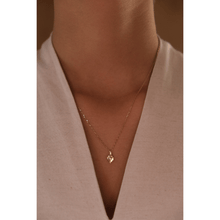 Load image into Gallery viewer, 18-karat yellow gold necklace with a pendant in a traditional Sadu design and natural diamond in the centre.
